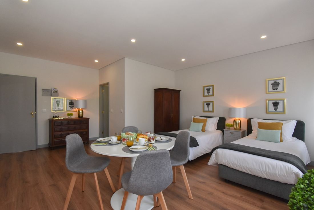Green Baixa — The dining corner beside the beds